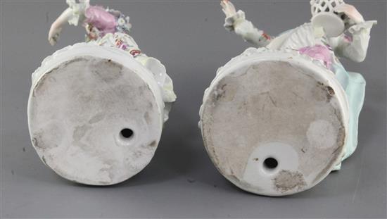 A pair of early Derby figures of a gentleman and his companion, c.1758, h. 25cm and 23.5cm